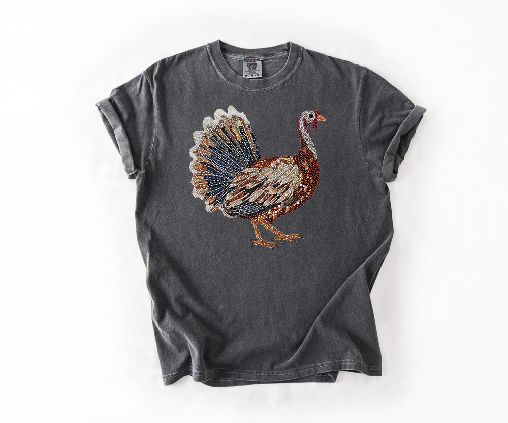 Gray t-shirt with a colorful turkey graphic on a white background