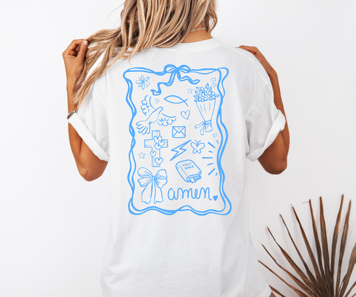 White t-shirt with blue graphic design on the back, worn by a person.