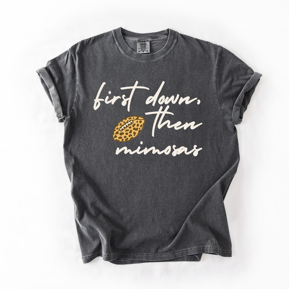 Black t-shirt with white text and a yellow pineapple graphic on a white background