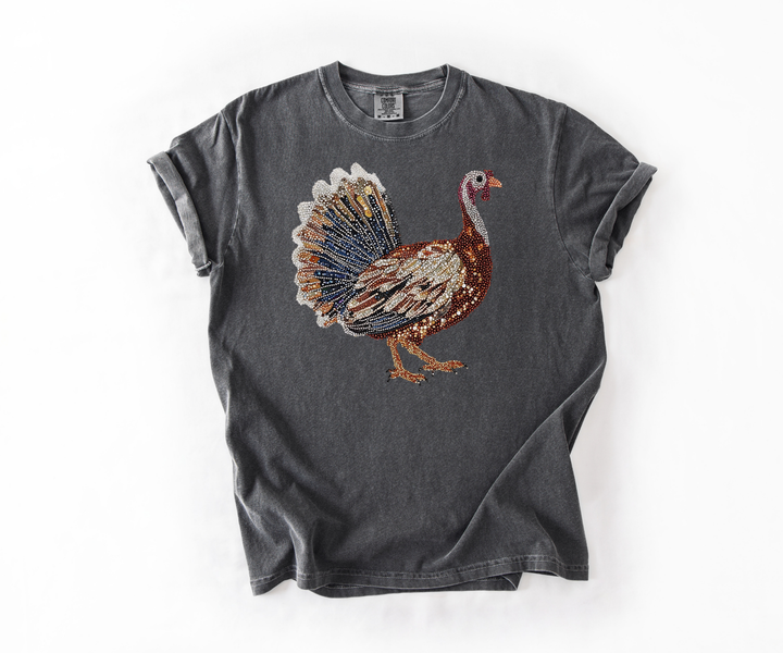 Gray t-shirt with a colorful turkey graphic on a white background