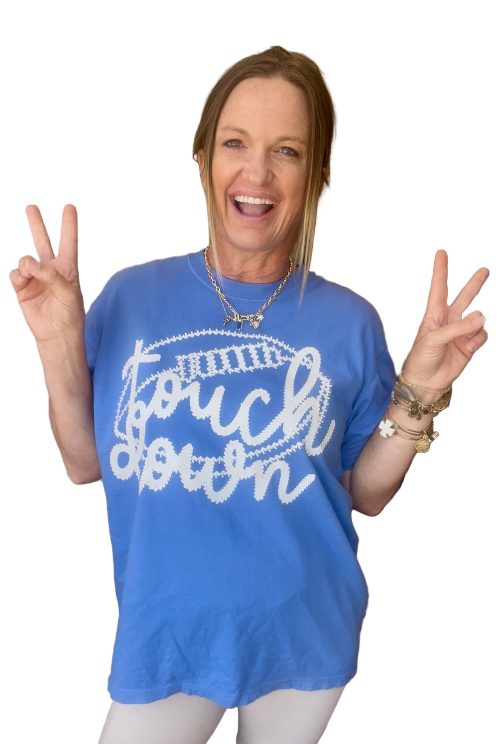 Person wearing a blue 'Touchdown' t-shirt in a store setting
